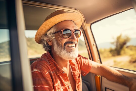 Fototapeta Carefree senior man driving vintage car, enjoying road trip adventure, smiling at scenic view