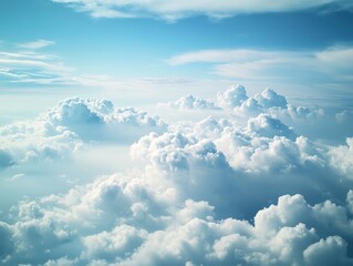 High-altitude view of fluffy cumulus clouds against a vibrant blue sky