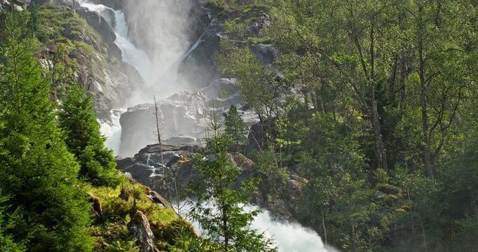 Latefossen Waterfall Norway &ndash; powerful cascade with mist and rapids in pine forest