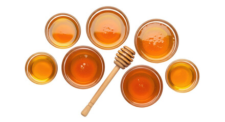 Isolated honey in bowls and honey dipper on table, sweet food ingredient, natural product