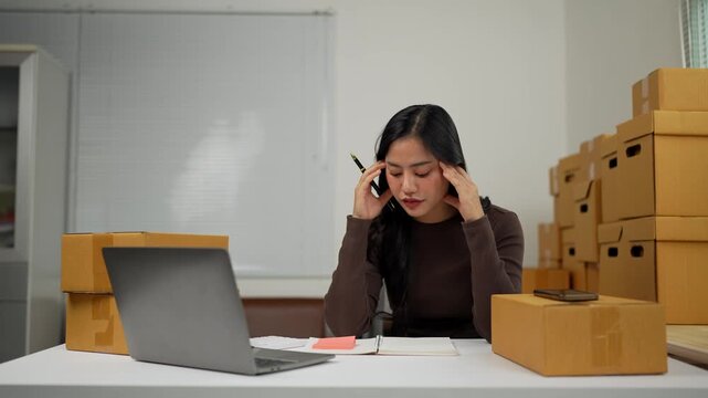 Online seller woman getting frustrated while managing orders