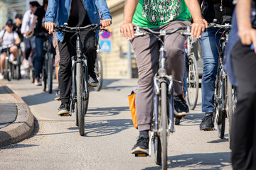 Group of cyclists on city road, street, asphalt