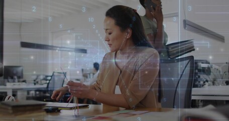 Connecting colored network cables technician wiring laptop ports in open-plan office, with overlay