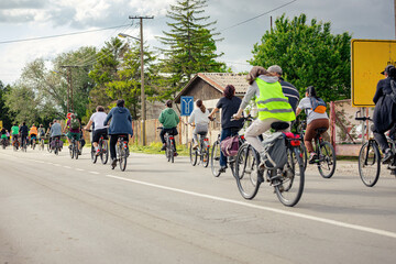 Group of cyclists on city road, street, asphalt