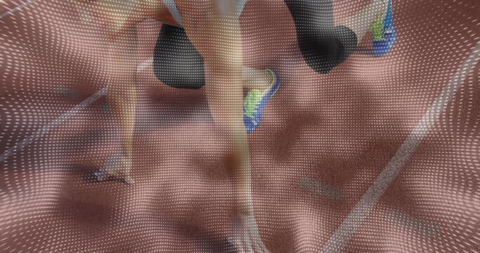 Two athletes in sportswear powering into sprint start on running track, with blocks, lane lines