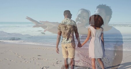 Naklejka premium Walking couple holding hands along sandy shoreline, with footprints and gentle ocean waves