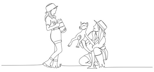 Continuous one line drawing of two women caring for a baby goat. One woman is holding the goat while the other holds a feeding bottle, symbolizing farming, animal care, and kindness to animals