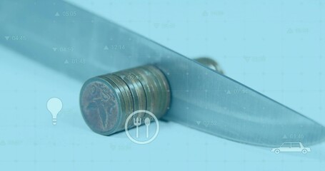Cutting coin stack under knife blade on blue studio surface, with grid overlay and data icons