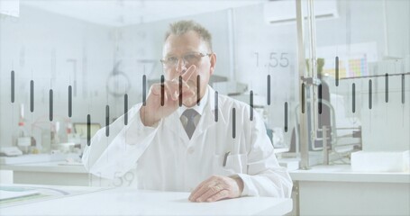Analyzing virtual data overlay, senior scientist wearing lab coat at curved table in bright lab