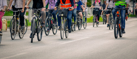 Group of cyclists on city road, street, asphalt