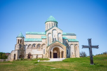 The majestic Bagrati Cathedral in Kutaisi, Georgia, stands as a UNESCO World Heritage Site and a masterpiece of medieval architecture. The stone cathedral with green rooftops and a large cross