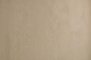 A detailed close up of a sandy surface that showcases a grainy texture