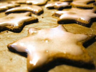 Closeup of a starshaped cookie with white frosting