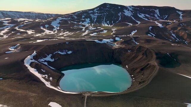 Explore the stunning Krafla Crater, featuring its turquoise waters set against volcanic landscapes. This breathtaking site showcases Icelands natural wonders amidst serene surroundings.