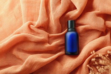 Blue bottle on peach fabric