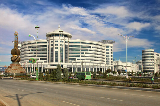 Ashgabat, Turkmenistan - October 20, 2023: View of the Sport Hotel and the art monument.