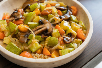 A cozy fall-inspired quinoa bowl filled with roasted vegetables, served warm and fresh