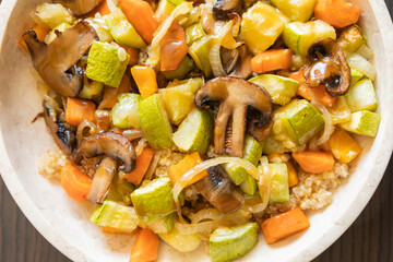 A cozy fall-inspired quinoa bowl filled with roasted vegetables, served warm and fresh
