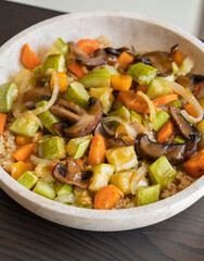 A cozy fall-inspired quinoa bowl filled with roasted vegetables, served warm and fresh