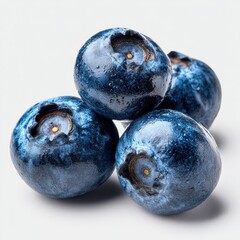 Close-up of three fresh blueberries piled on a white background.  The blueberries are deep blue, glossy, and appear plump and juicy.  A few droplets of moisture cling to their surfaces.  