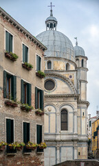 Marvel at Santa Maria dei Miracoli rising above Venetian homes