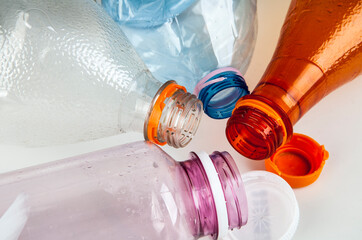 Empty plastic bottles, beverage containers. Recyclable material. Plastic bottles isolated on a white background. Recycling concept