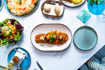 Pizza with salad and  juice on marble table Morocco September 3, 2025