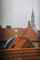 Aerial view of red roofs of traditional buildings in the city center of Copenhagen in Denmark.