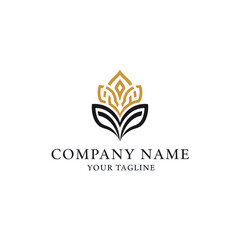 Elegant black and gold stylized floral emblem logo, featuring intricate leaf and crown-like motifs for branding.