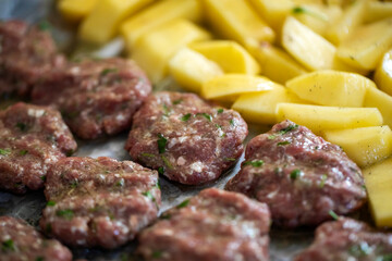 Meatballs and patatoes raw food