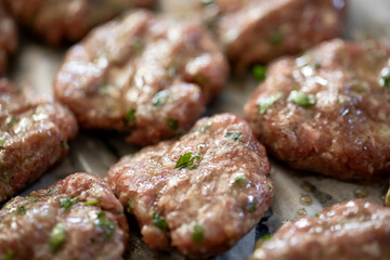Raw Turkish organic meatballs in a row backgrounds