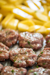 Meatballs and patatoes raw food