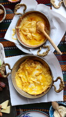 Authentic Turkish Kuymak and Omelet Side by Side on Breakfast Table