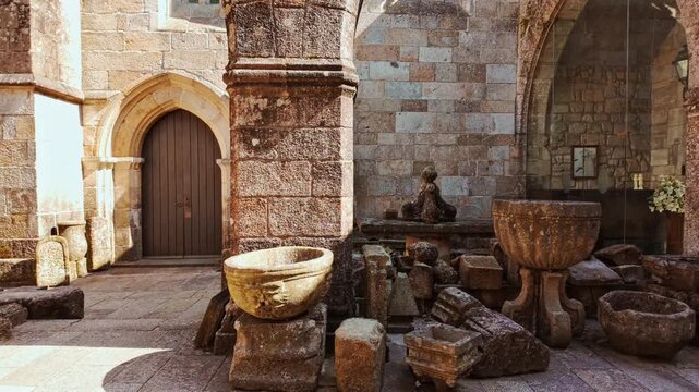 Braga Cathedral exteriors display Romanesque portals gothic pinnacles and weathered granite walls anchoring the old town in Braga, Portugal