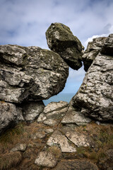 A window through rock formations with a view of the ocean behind, at Zennor on the Cornish coast