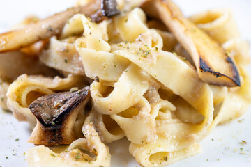 Homemade Italian fettuccine pasta with mushrooms and cream sauce