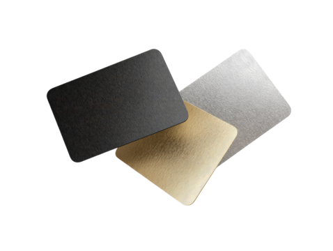 Three overlapping rectangular metal samples in dark gray, light gray, and gold tones