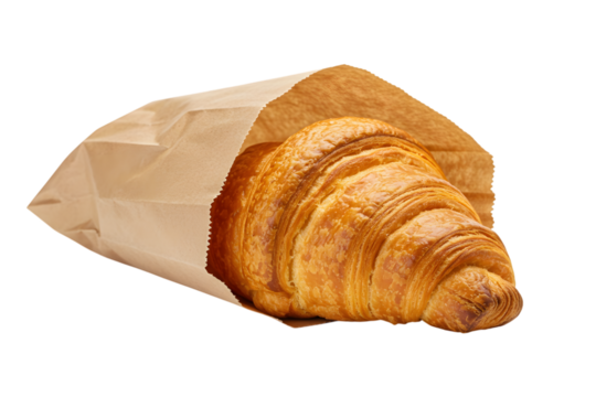 A golden croissant in a brown paper bag isolated on transparent background