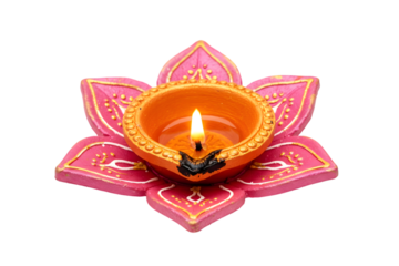 Traditional diwali diya lamp isolated on transparent background, decorated with pink lotus petals