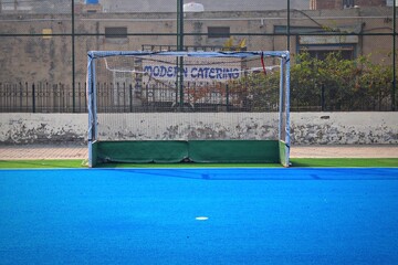 Field Hockey Goalpost on Vibrant Blue Turf – Outdoor Sports Facility