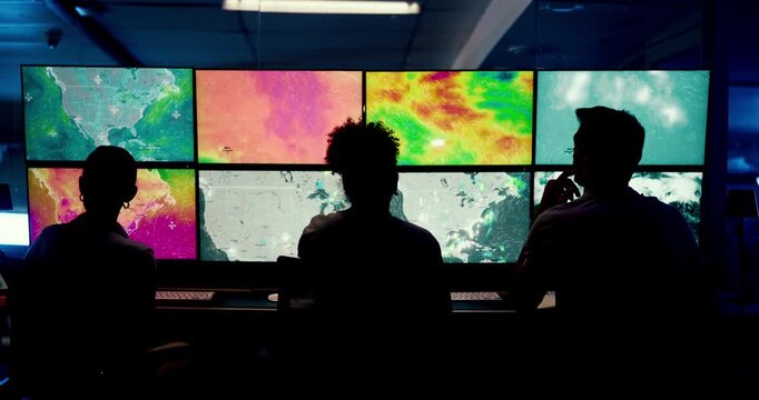 Computer, screen and people with meteorology, office and broadcast for news or research. Discussion, silhouette and weather team with forecast for media report, satellite map or climate change update