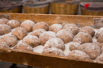 yeast dough in the form of loaves waiting to be cooked