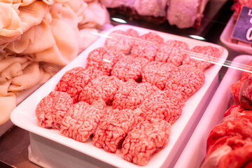 Raw lamb brains on market counter