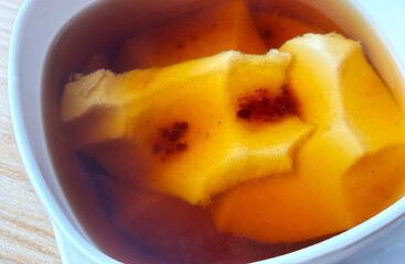 Soft Tofu in ginger soup, healthy Asian dessert. Close up healthy food.