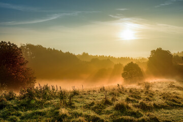 Beautiful sunrise in fog and haze, Danish landscape
