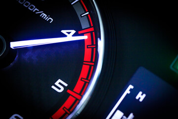 Close-up of a diesel truck's dashboard and tachometer. It represents the power and durability of a...