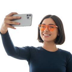 Smiling young woman takes a selfie with orange blue light blocking glasses transparent background