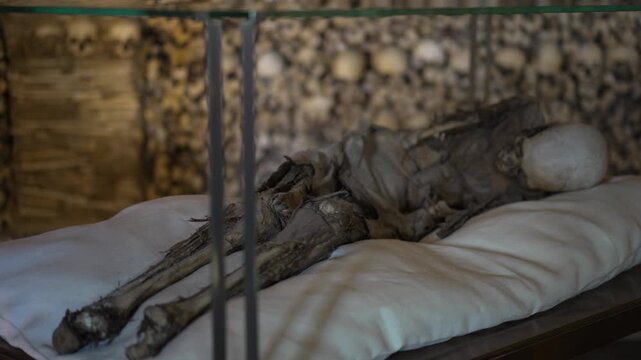 The Chapel of Bones located in the city of Evora built by Franciscan Monks and decorated with human skulls and bones on the sides creating a macabre design.
