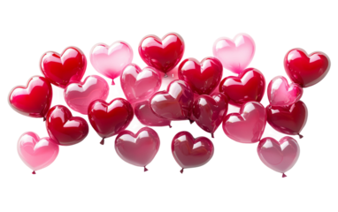 Red and pink balloons in heart shapes floating gracefully as a romantic decoration symbolizing love and celebration for special occasions isolated on transparent background PNG