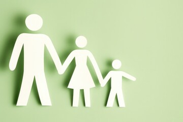 Paper cutout family on light green background studio shot simple warm family scene